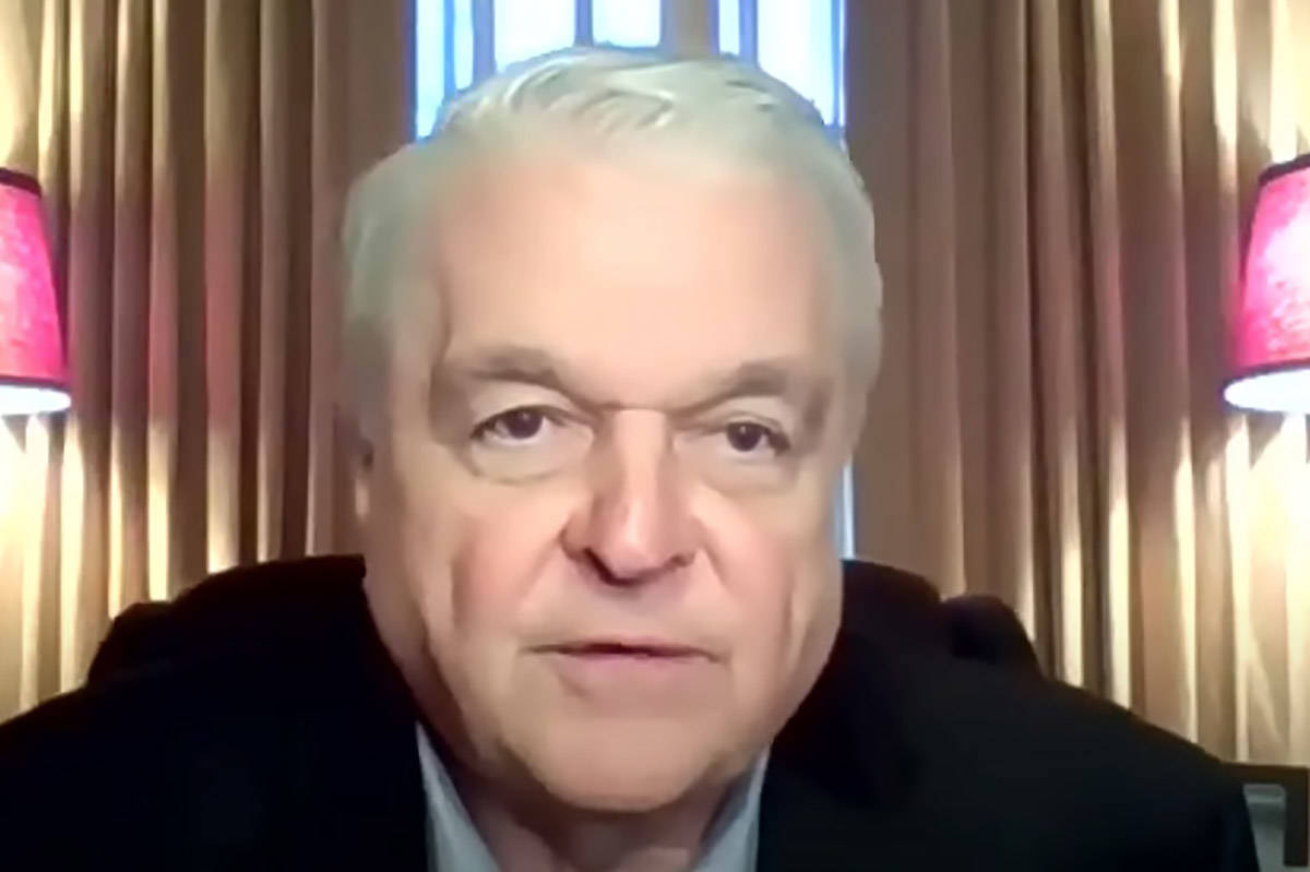 Gov. Steve Sisolak appears remotely during a press conference Nov. 22, 2020, announcing new res ...