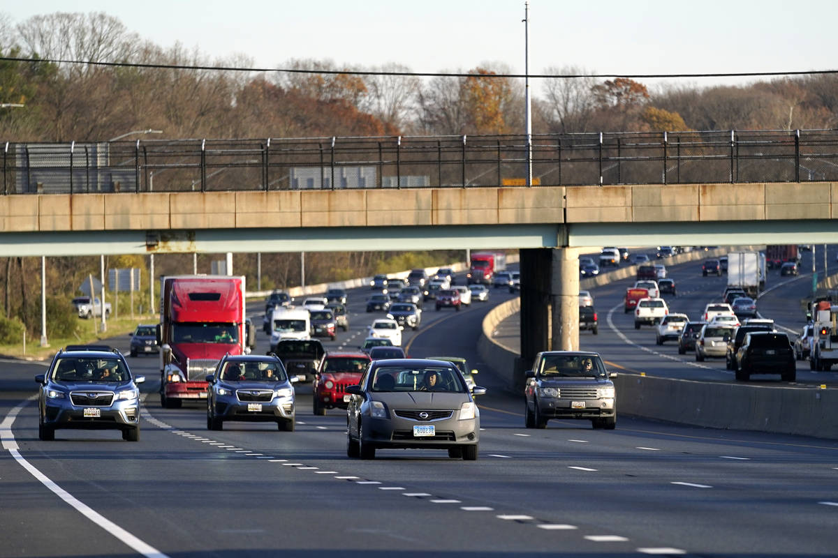 Vehicles travel westbound on Interstate 695, Tuesday, Nov. 24, 2020, in Parkville, Md. (AP Phot ...