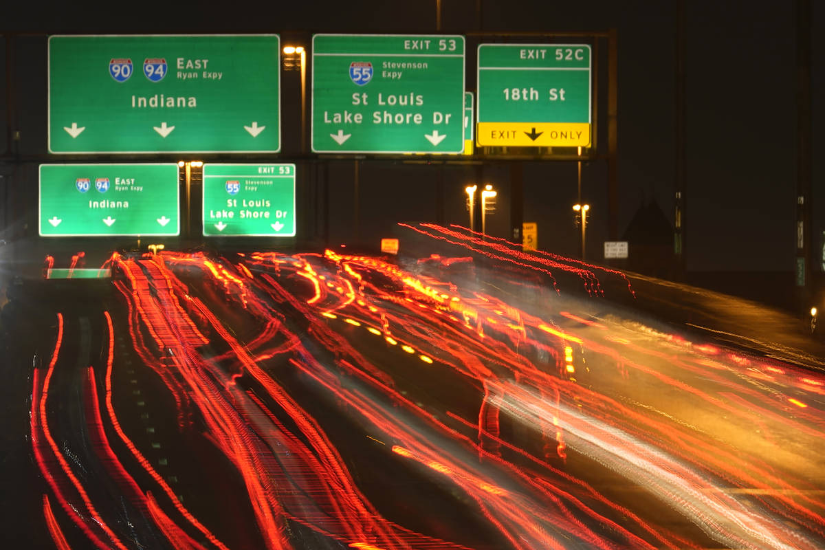 Motorists travel south Tuesday, Nov. 24, 2020, along Interstates 90 and 94 in Chicago. (AP Phot ...