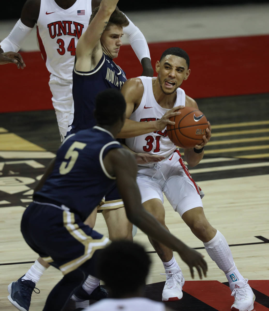 UNLV Rebels guard Marvin Coleman (31) is pressured by Montana State Bobcats guard Nick Gazelas ...