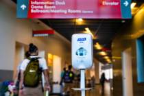 A hand sanitizer dispenser is installed for use at the entrance to the UNLV Student Union build ...
