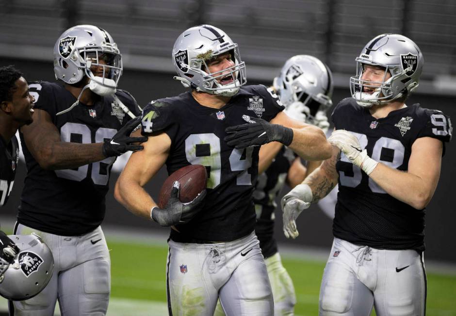 Las Vegas Raiders defensive end Carl Nassib (94) celebrates after intercepting a pass with team ...