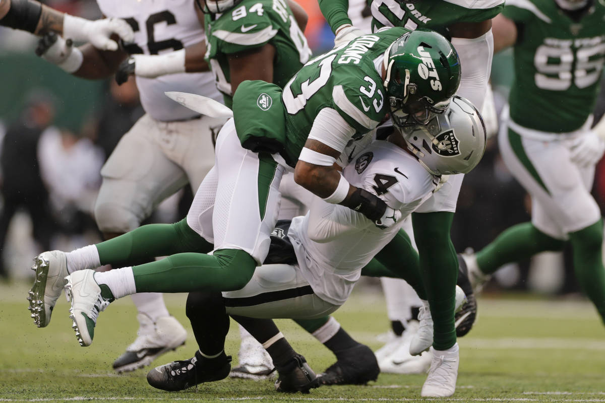 New York Jets strong safety Jamal Adams (33) sacks Oakland Raiders quarterback Derek Carr (4) d ...