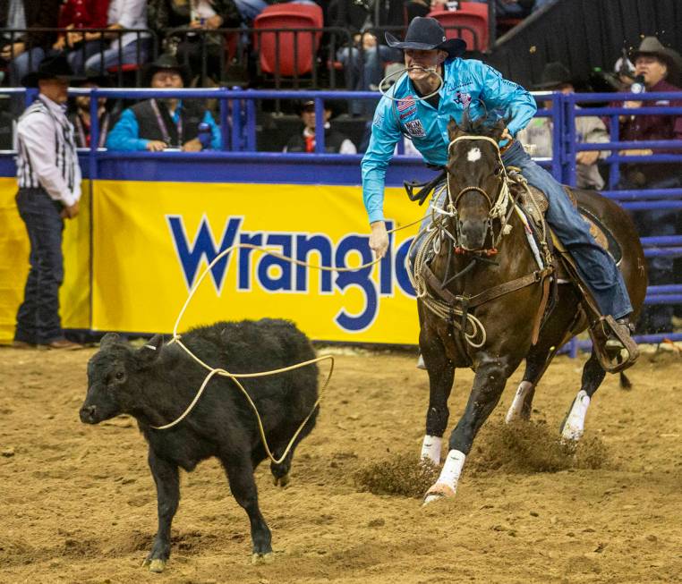 Tuf Cooper of Decatur, Texas, eyes his steer in Tie-Down Roping at the tenth go round of the Wr ...