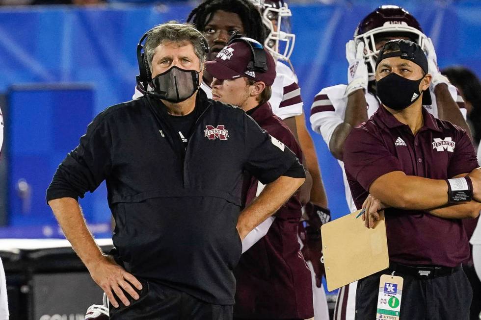 In this Saturday, Oct. 10, 2020, file photo, Mississippi State coach Mike Leach stands on the s ...