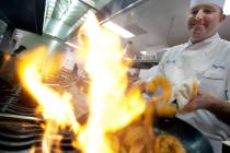 In this Wednesday, Jan. 7, 2009 file photo, Executive Chef Tory McPhail cooks Lemon and Garlic ...