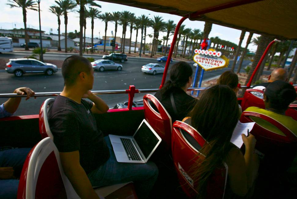 Tony Hsieh, CEO of of online clothing maker Zappos.com, passes the "Welcome to downtown L ...