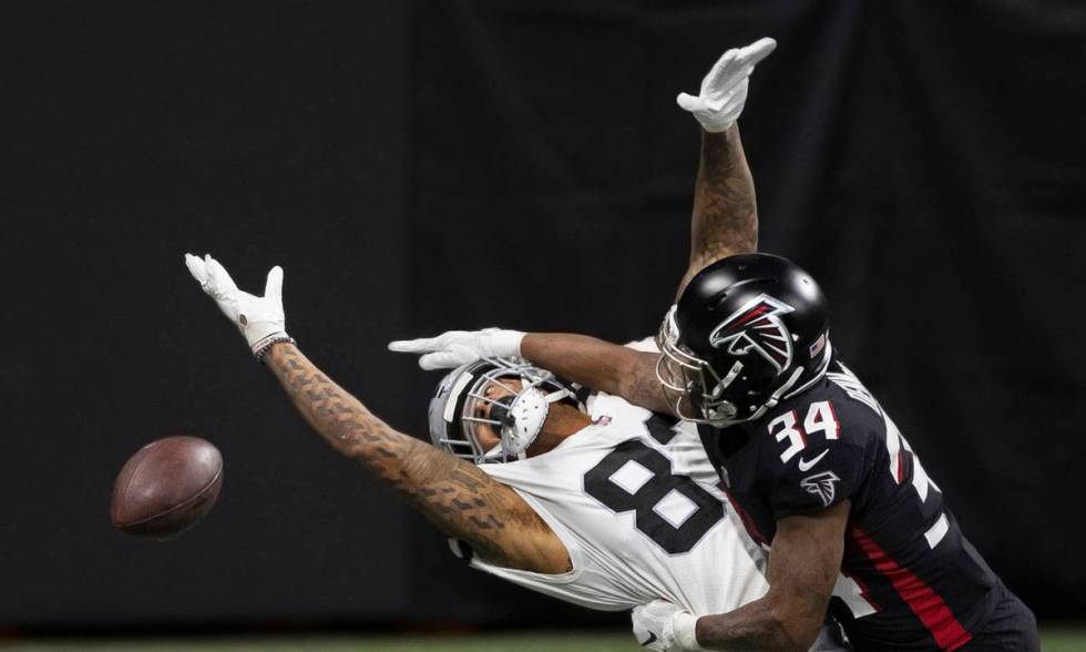 Las Vegas Raiders tight end Darren Waller (83) extends to try and make a catch over Atlanta Fal ...