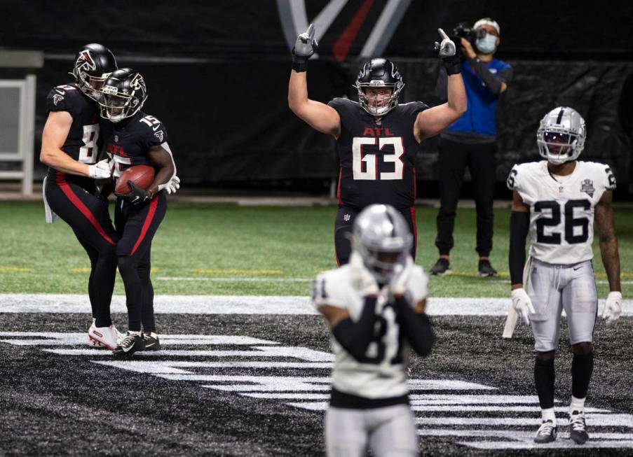 Atlanta Falcons wide receiver Brandon Powell (15) celebrates with Atlanta Falcons tight end Jae ...