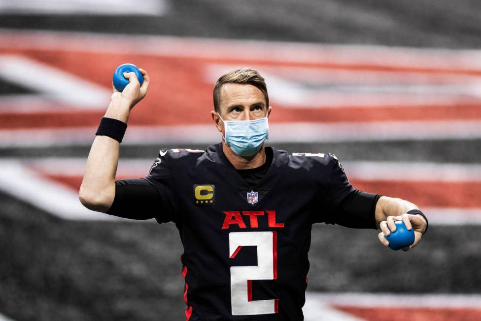 Atlanta Falcons quarterback Matt Ryan (2) warms up before the start of an NFL football game aga ...