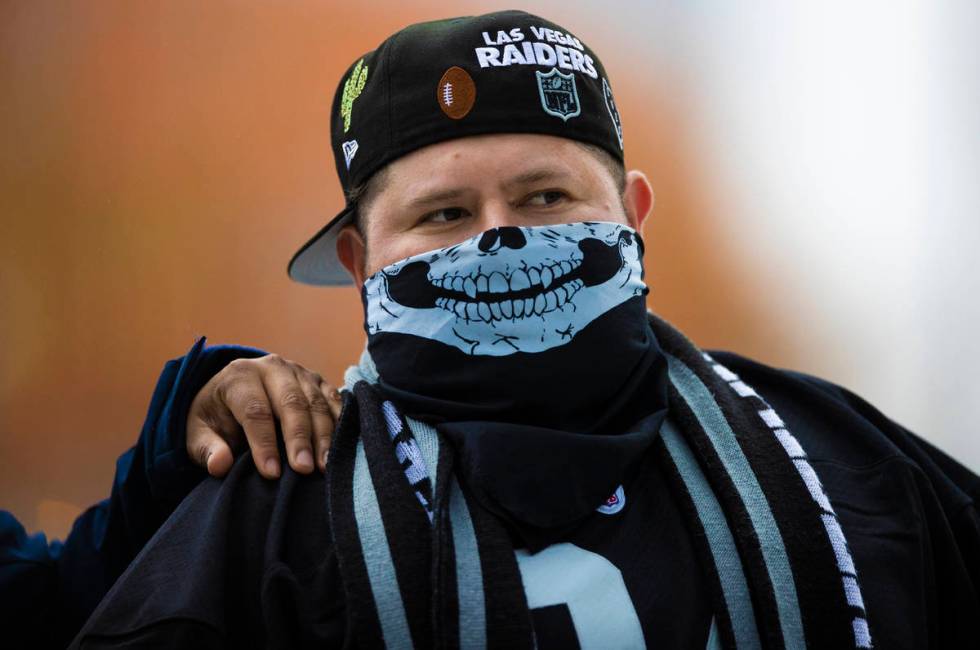 Michael De La Cruz, from Los Angeles, Calif., walks to his seat before the start of an NFL foot ...