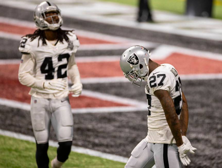 Las Vegas Raiders cornerback Trayvon Mullen (27) and Las Vegas Raiders outside linebacker Cory ...