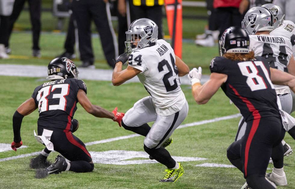 Las Vegas Raiders strong safety Johnathan Abram (24) returns an interception past Atlanta Falco ...