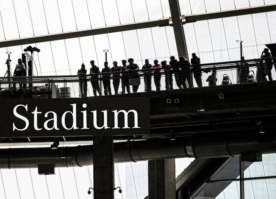 Fans watch from the cat walk during an NFL football game between the Las Vegas Raiders and the ...