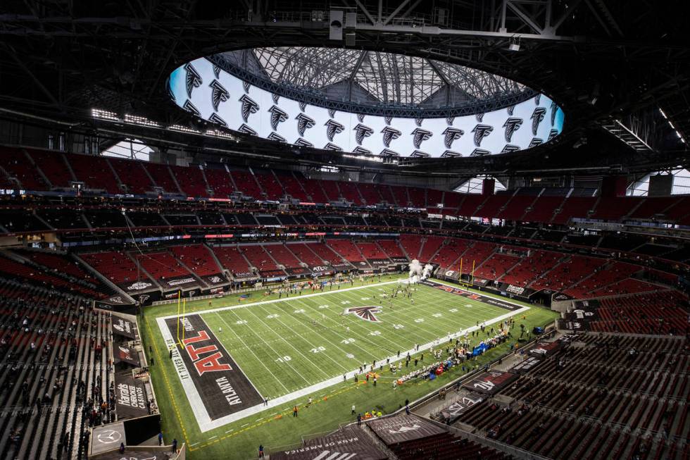 The Atlanta Falcons take the field before the start of an NFL football game against the Las Veg ...