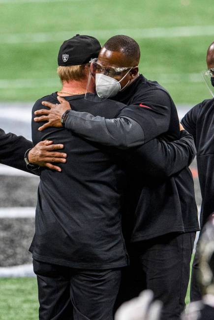 Atlanta Falcons interim head coach Raheem Morris and Las Vegas Raiders head coach Jon Gruden em ...