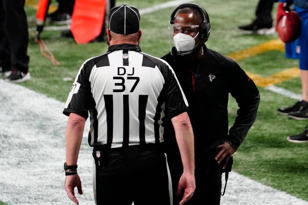 Atlanta Falcons interim head coach Raheem Morris speaks to an official during the second half o ...