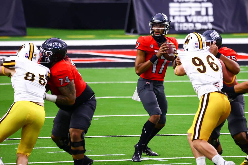 UNLV Rebels quarterback Doug Brumfield (17) looks to throw a pass against the Wyoming Cowboys d ...