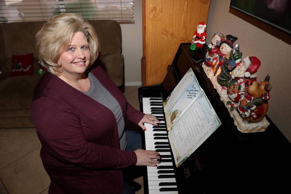 Kim Ritzer, director of choir at Green Valley High School, poses for a portrait at her home in ...