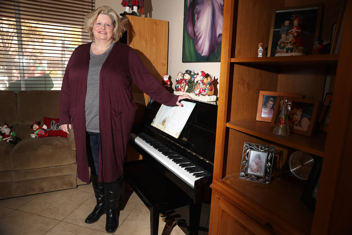Kim Ritzer, director of choir at Green Valley High School, poses for a portrait at her home in ...