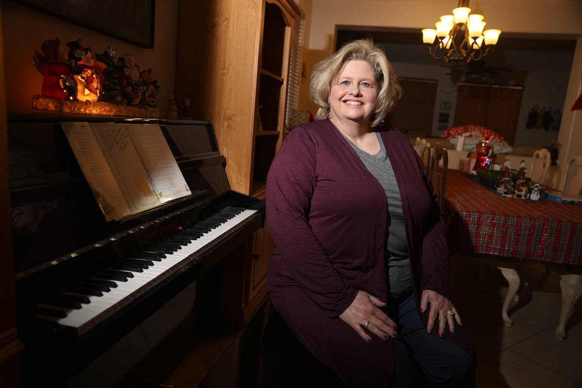 Kim Ritzer, director of choir at Green Valley High School, poses for a portrait at her home in ...