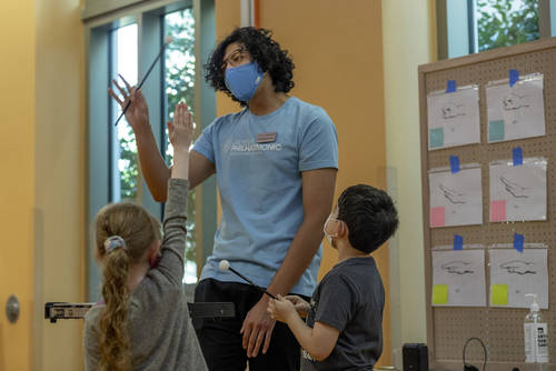 Las Vegas Philharmonic instructor Christopher Vivas works with the kids during a class. Open to ...