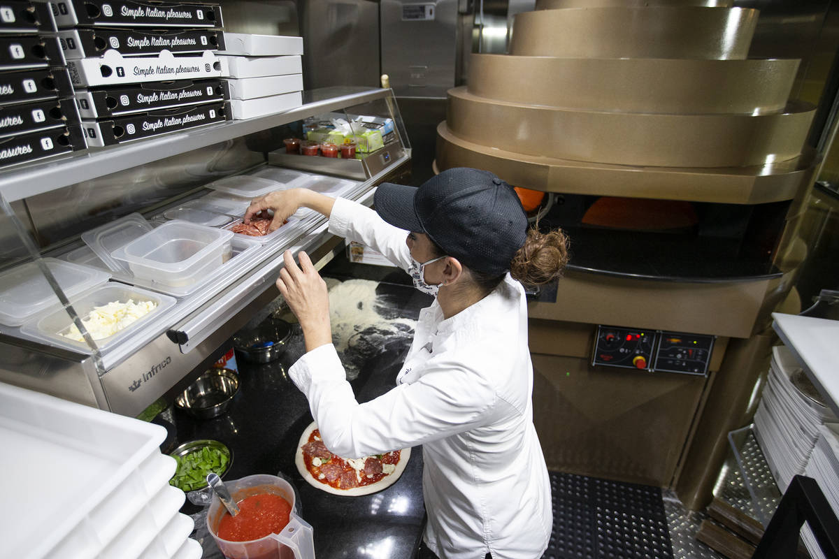 Chef Floriana Pastore makes a pizza on her high-tech converted shipping container, custom built ...