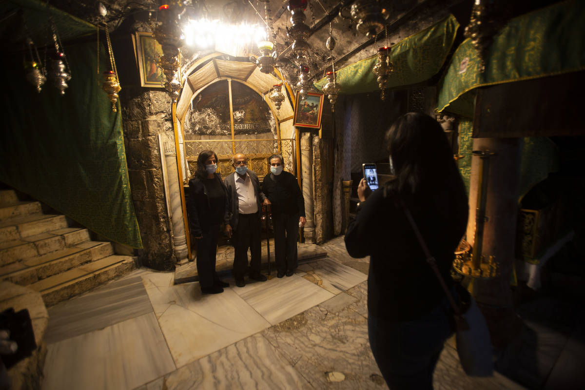 Christian take photos inside the Grotto of the Church of the Nativity, traditionally believed t ...