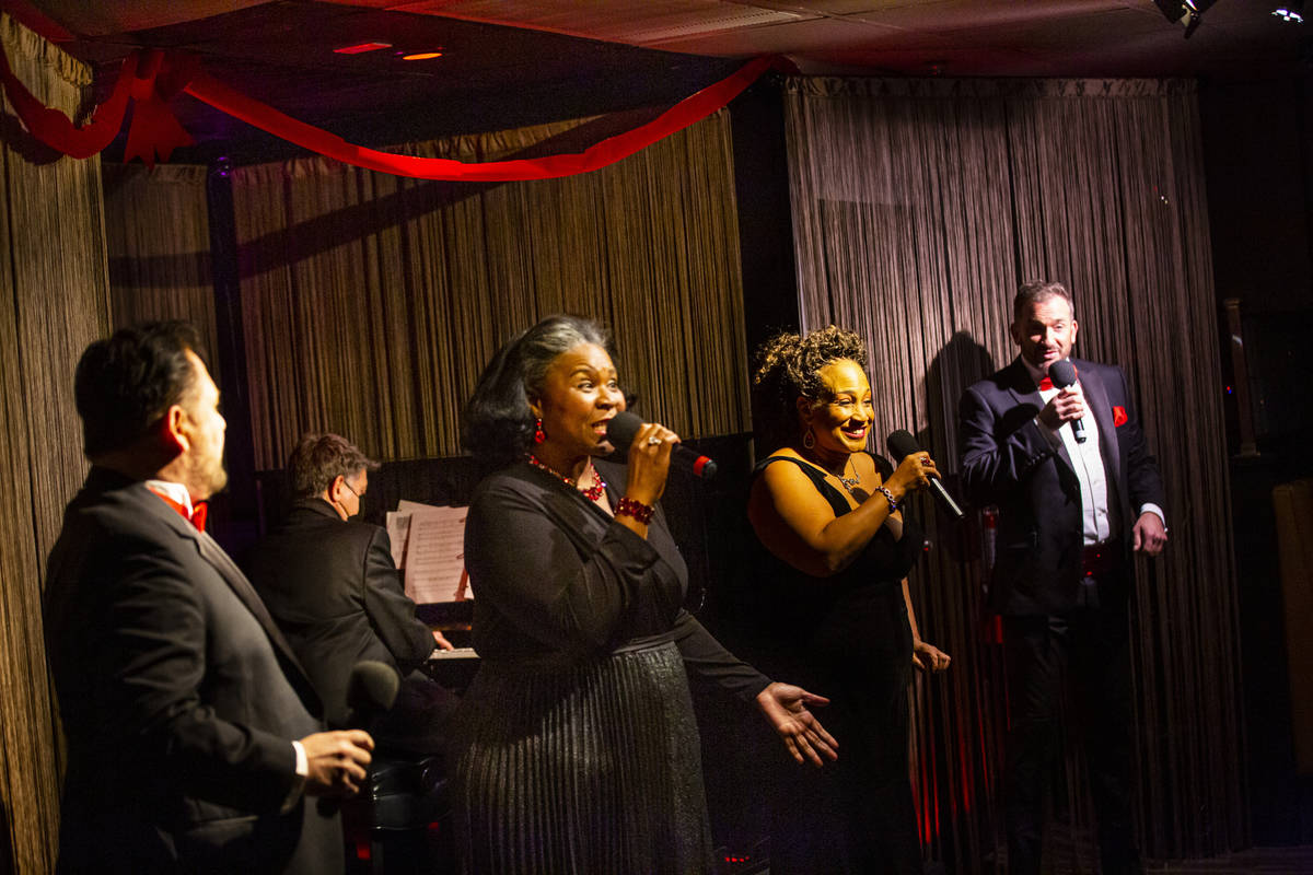 Singers, from left, Randal Keith, Amanda King, Michelle Johnson and Sam Holder perform along wi ...