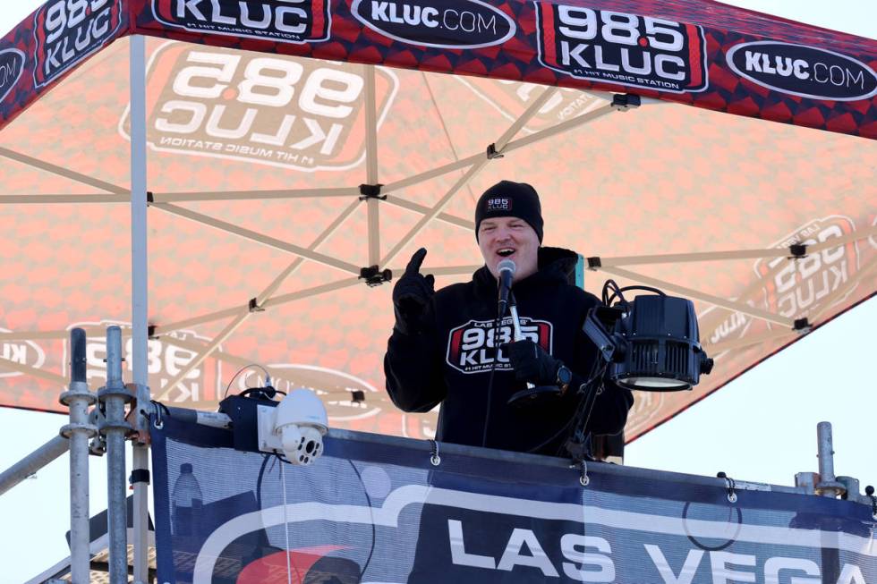 Chet Buchanan of KLUC-FM talks to volunteers atop a 30-foot scaffolding during his toy drive in ...