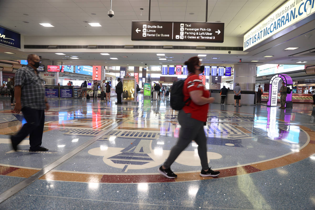 People leave baggage claim in Terminal 1 at McCarran International Airport in Las Vegas, Monday ...