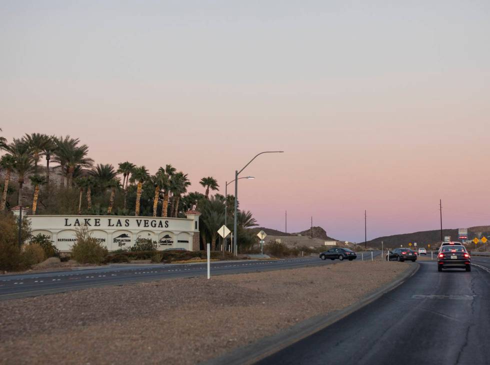 Vehicles drive on Lake Mead Parkway near the entrance of Lake Las Vegas in Henderson on Wednesd ...