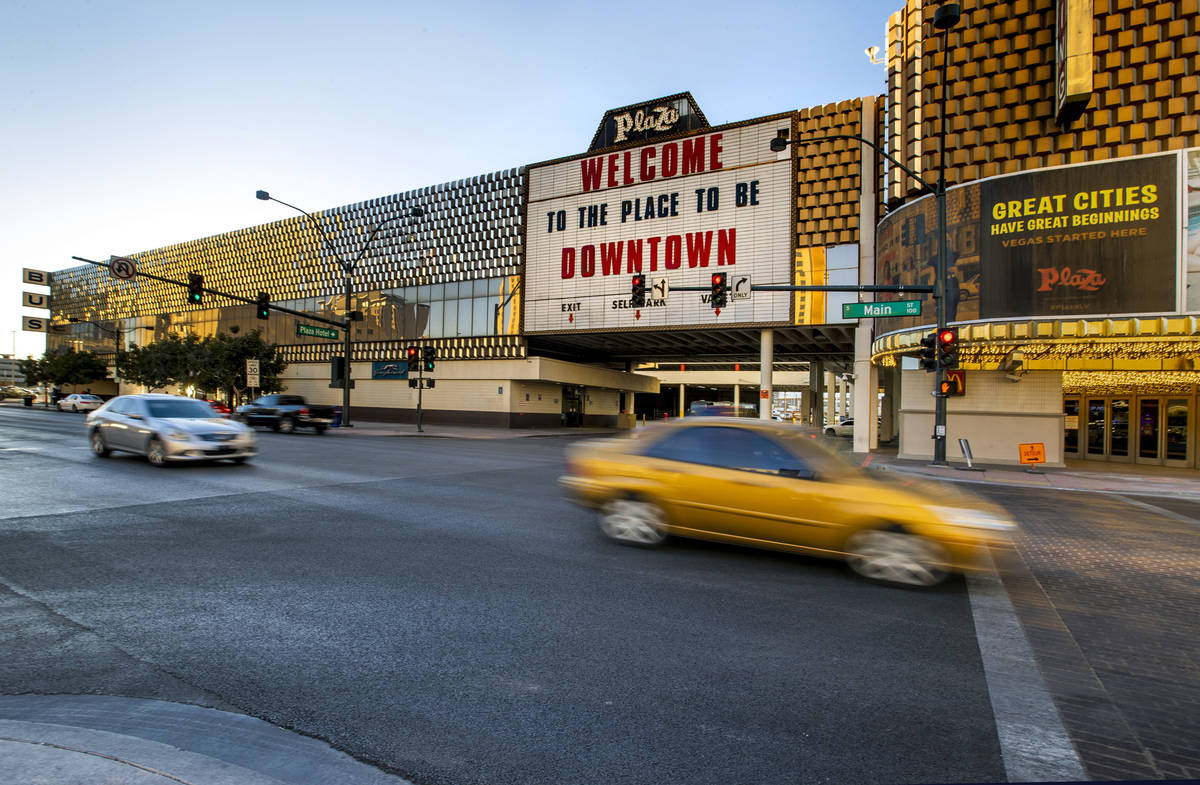 Cars stream past the current Greyhound bus terminal building downtown which the Plaza Hotel and ...
