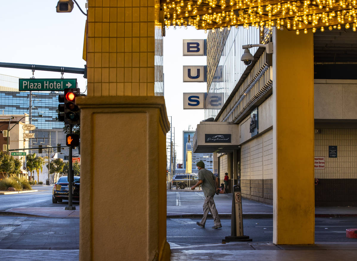 A pedestrian walks along as the Plaza Hotel and Casino announces it will redevelop a building t ...