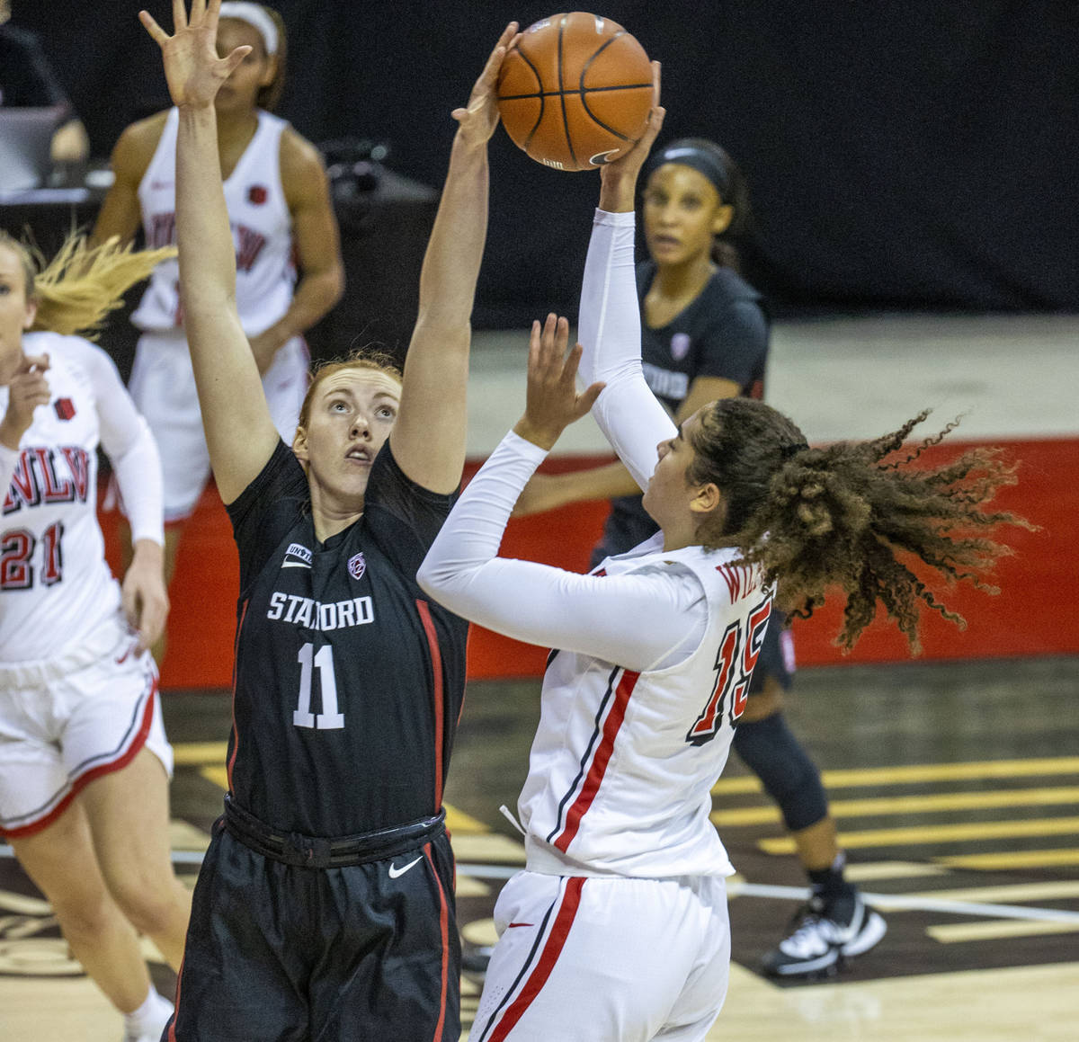 Stanford Cardinal forward Ashten Prechtel (11, left) blocks a shot by UNLV Lady Rebels center K ...