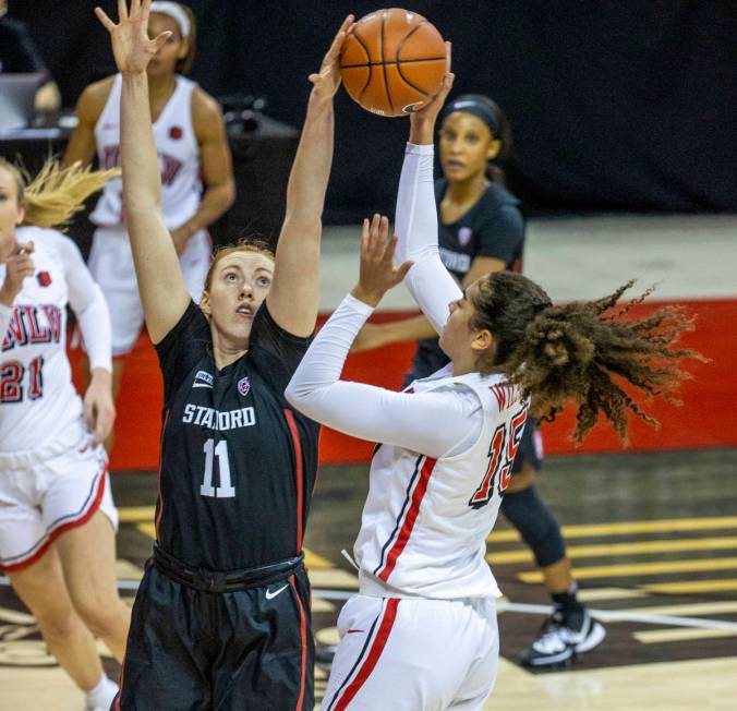 Stanford Cardinal forward Ashten Prechtel (11, left) blocks a shot by UNLV Lady Rebels center K ...