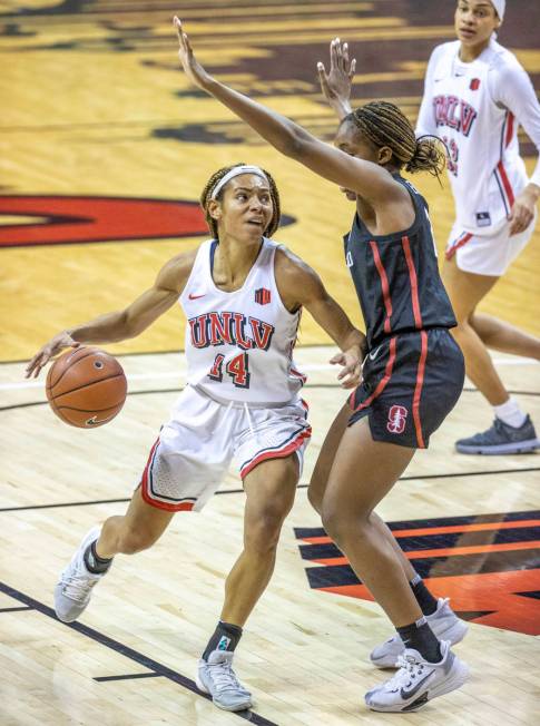 UNLV Lady Rebels guard Bailey Thomas (14, left) looks to drive on Stanford Cardinal guard Agnes ...