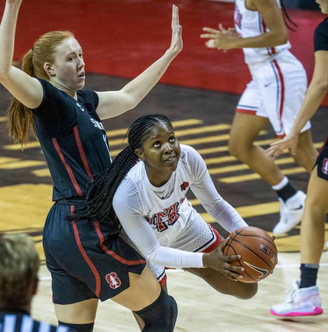 UNLV Lady Rebels forward Anna Blount (12, right) looks to the basket after getting past Stanfor ...