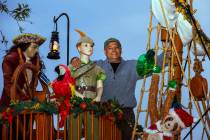 Juan Torres stands atop the pirate ship he built for his wife Maria Acosta as part of a holiday ...