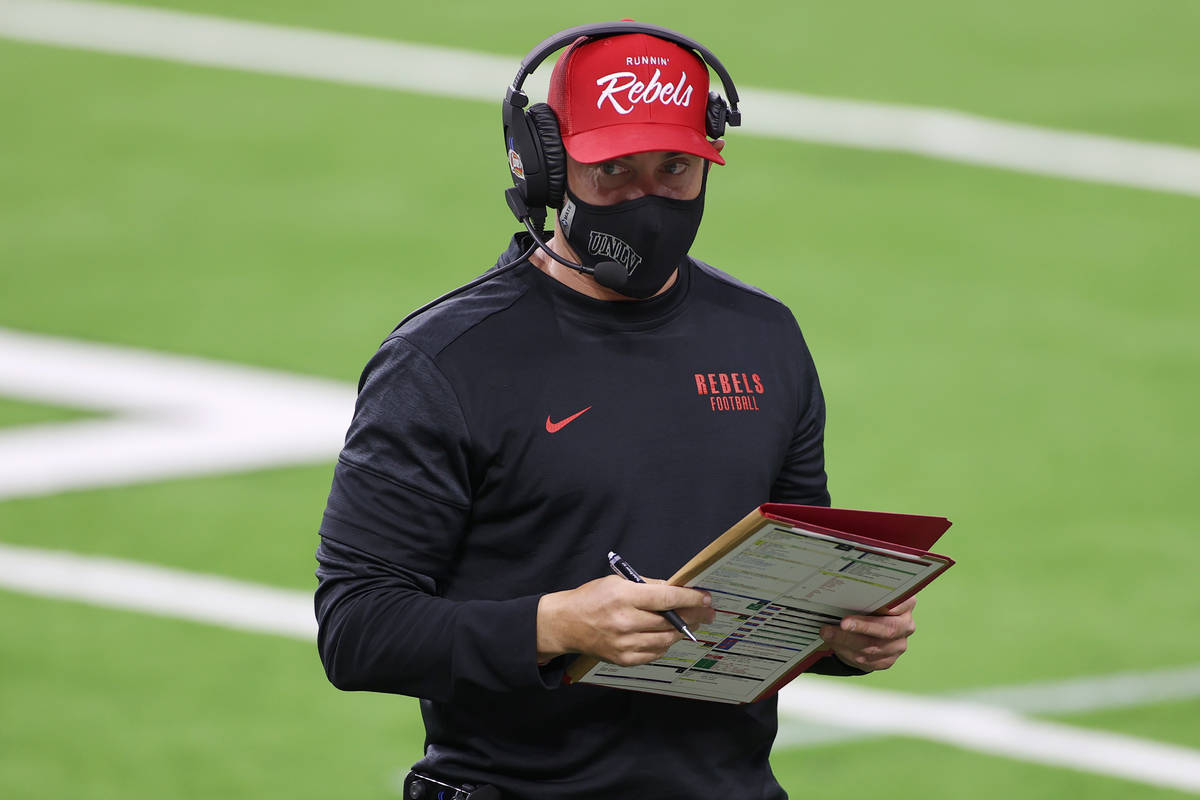 UNLV Rebels head coach Marcus Arroyo on the field during the first quarter of their NCAA footba ...