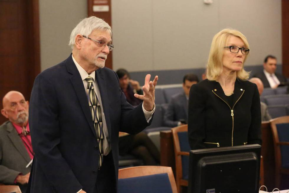 Larry Bertsch, left, stands with his attorney, Alice Denton, on March 1, 2018, to address Distr ...