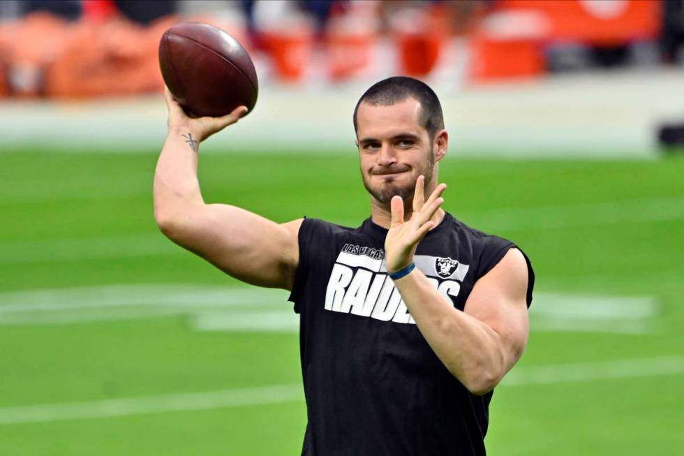 Las Vegas Raiders quarterback Derek Carr (4) warms before an NFL football game, Sunday against ...