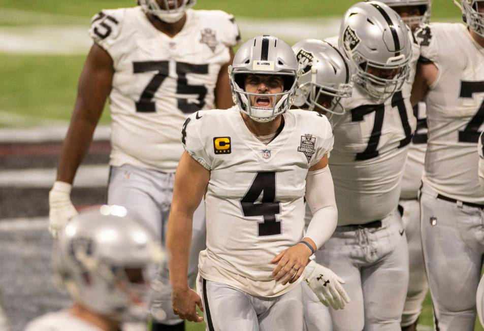 Las Vegas Raiders quarterback Derek Carr (4) jogs off the field dejected after a three-and-out ...