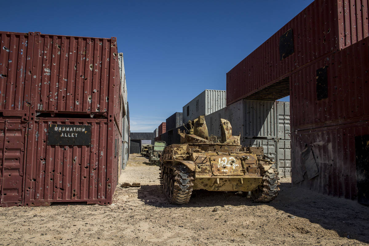 An armored vehicle riddled with bullet holes waits in "Damnation Alley," where aircraft and gro ...