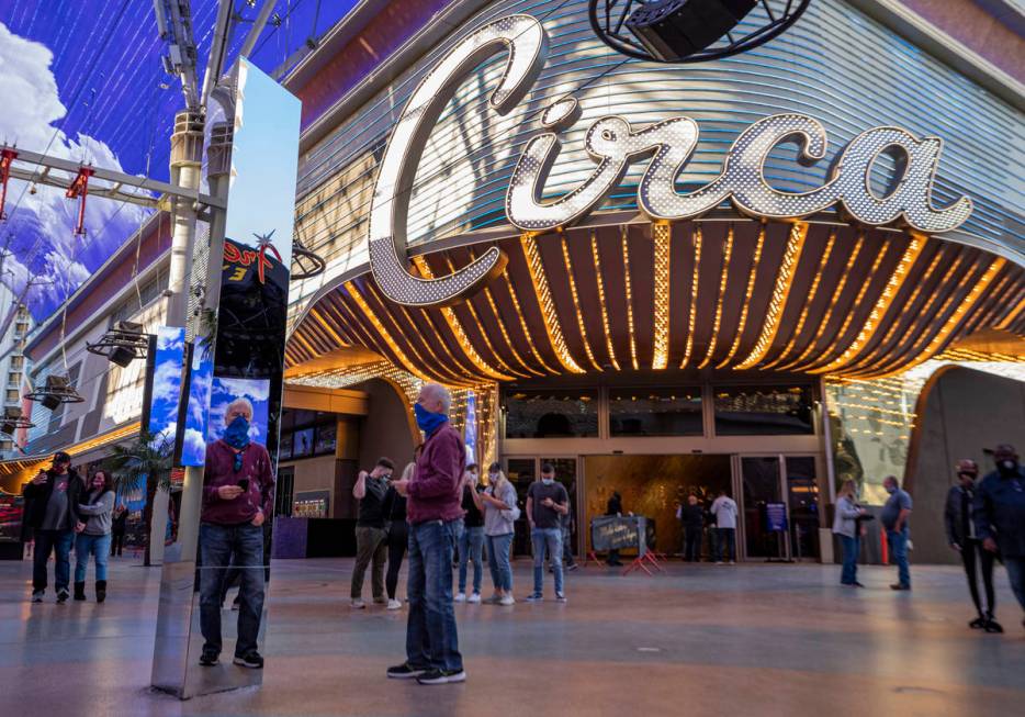 Dale Eagle, 74, looks at his reflection in a 10-foot monolith standing under the Fremont Street ...