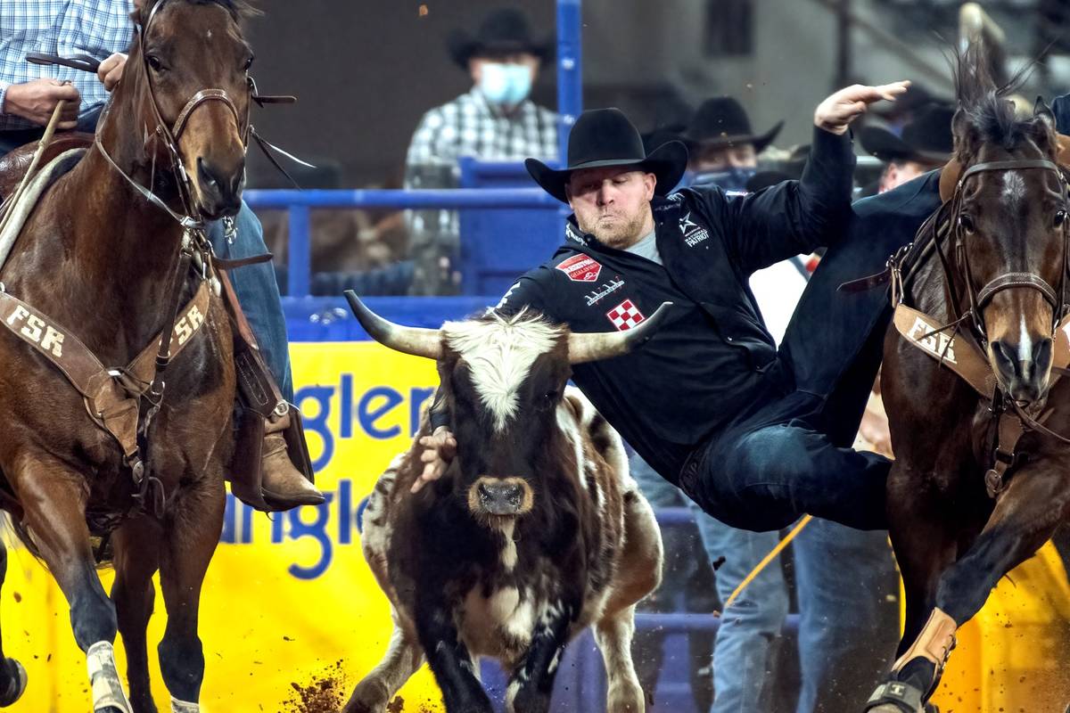 Will Lummus performs during the 3rd go-round of the National Finals Rodeo in Arlington, Texas, ...