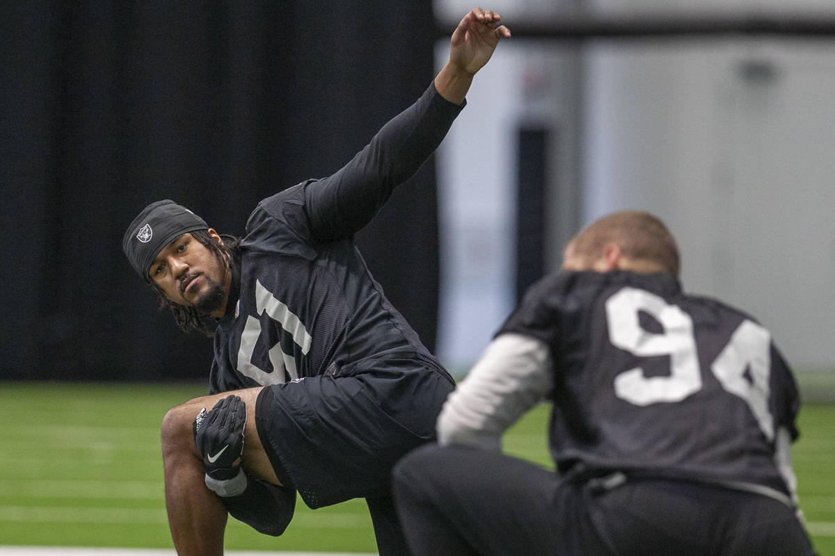 Las Vegas Raiders dfensive end Vic Beasley (51) stretches during a practice session at the Inte ...