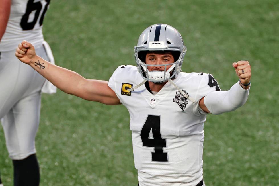 Las Vegas Raiders quarterback Derek Carr (4) reacts after throwing a game winning touchdown pas ...