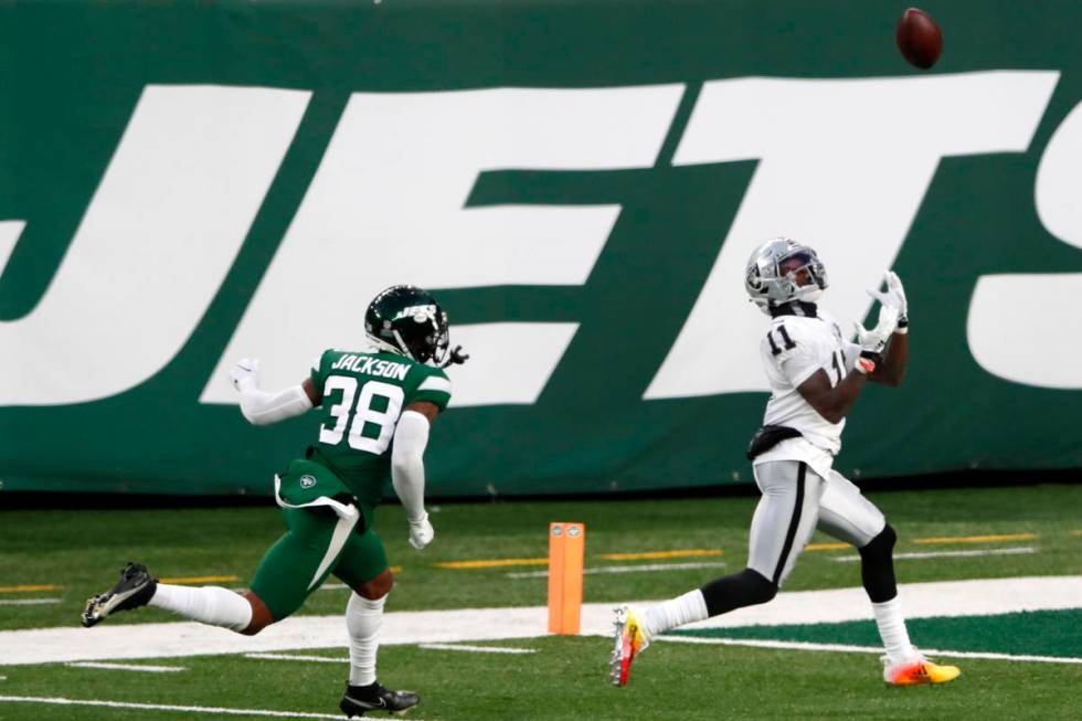 Las Vegas Raiders' Henry Ruggs III, right, catches a touchdown during the second half an NFL fo ...