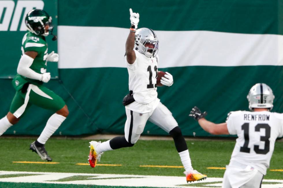 Las Vegas Raiders' Henry Ruggs III, center, celebrates his touchdown during the second half an ...